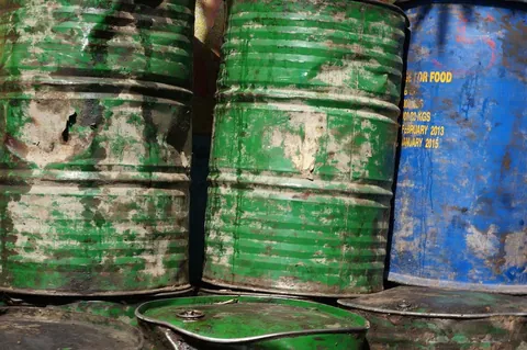 3d green drums with recycle symbol