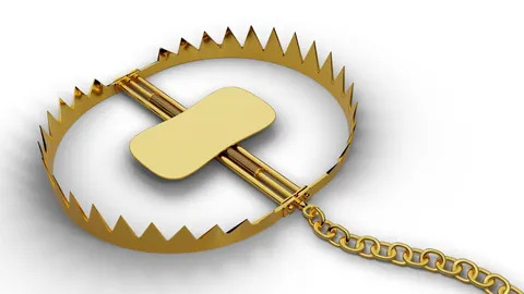 Trap with gold nugget on white background.